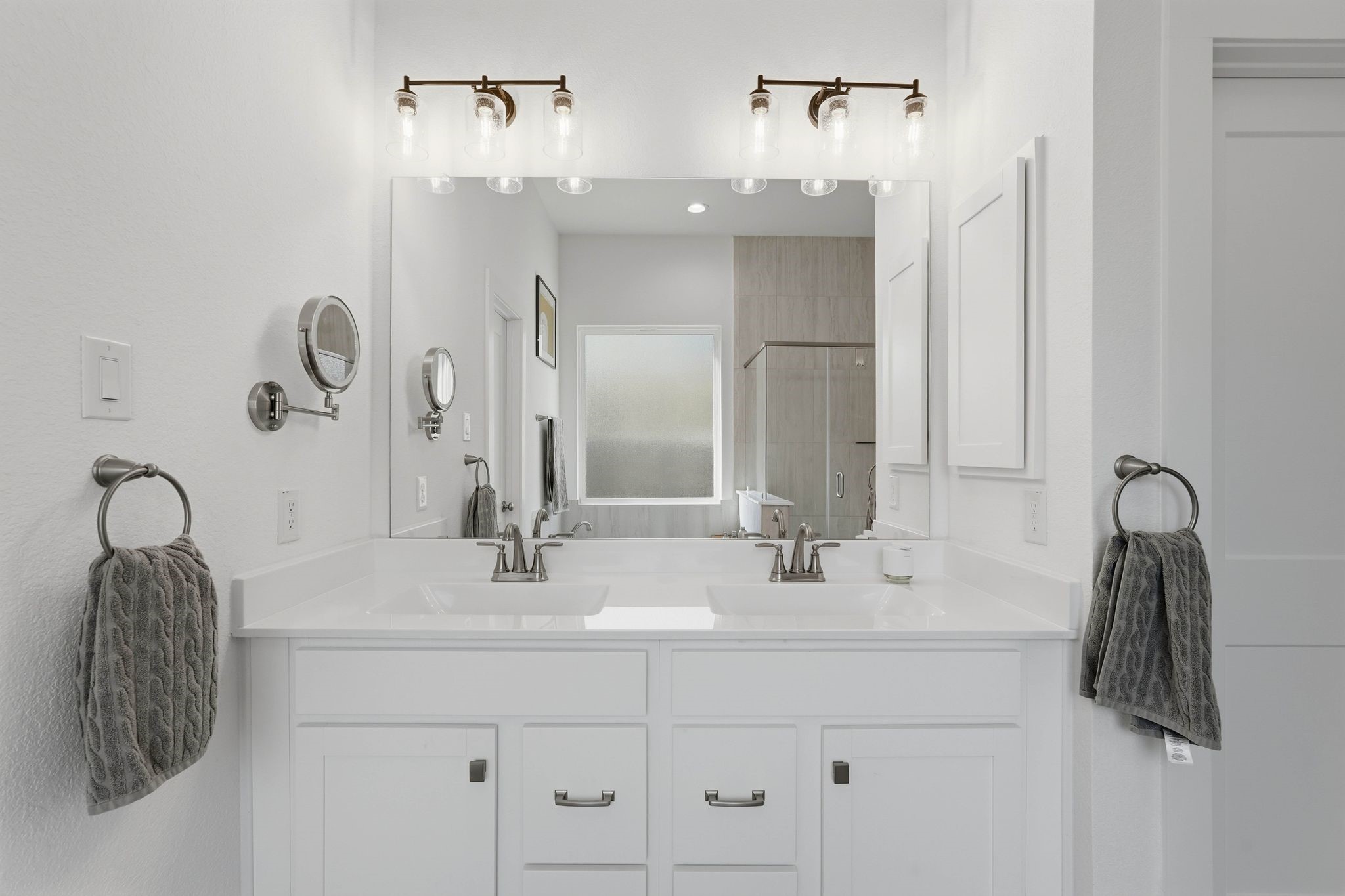 17907 Purple Amaranth Conroe, TX 77385 - Photo 20 of 30 a bathroom with a double vanity sink and a mirror