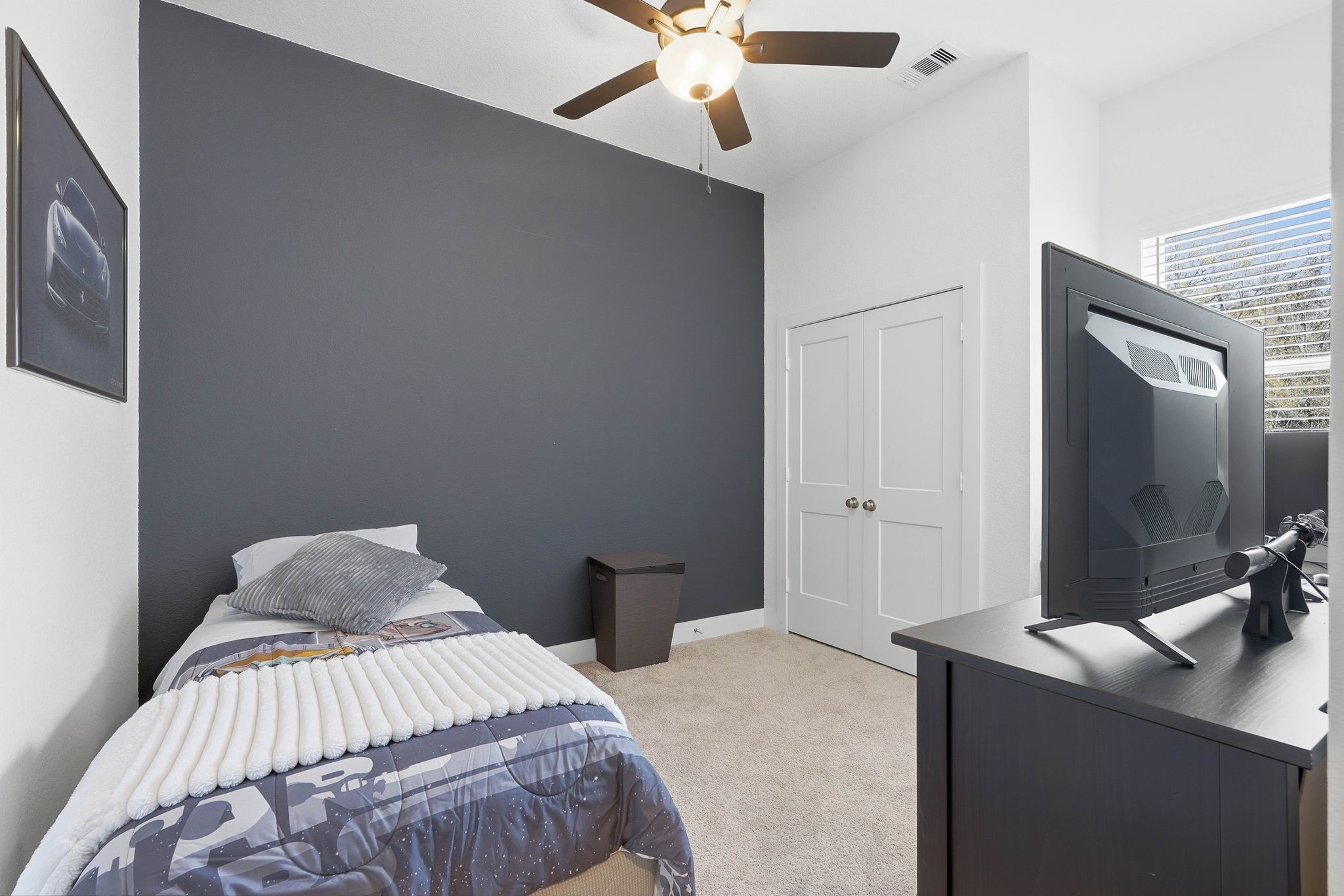 17907 Purple Amaranth Conroe, TX 77385 - Photo 21 of 30 a bedroom with a bed and a chandelier