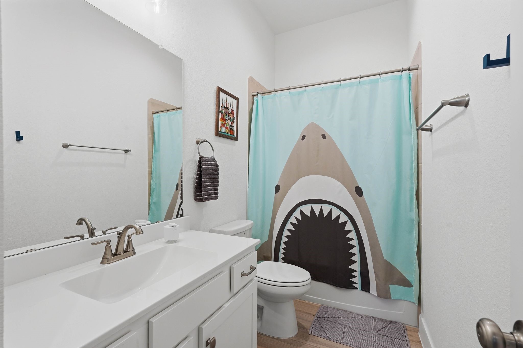 17907 Purple Amaranth Conroe, TX 77385 - Photo 22 of 30 a bathroom with a sink a toilet and a mirror