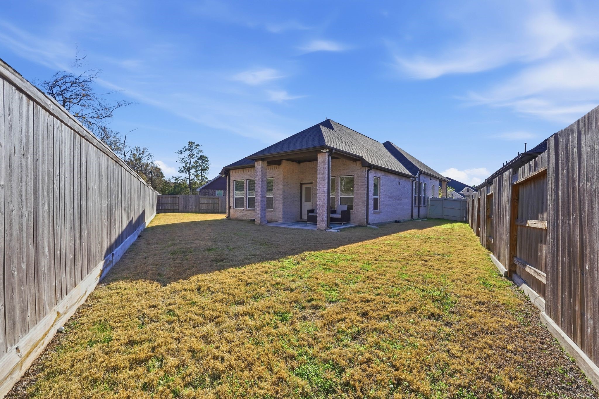 17907 Purple Amaranth Conroe, TX 77385 - Photo 27 of 30 a view of a house with a backyard
