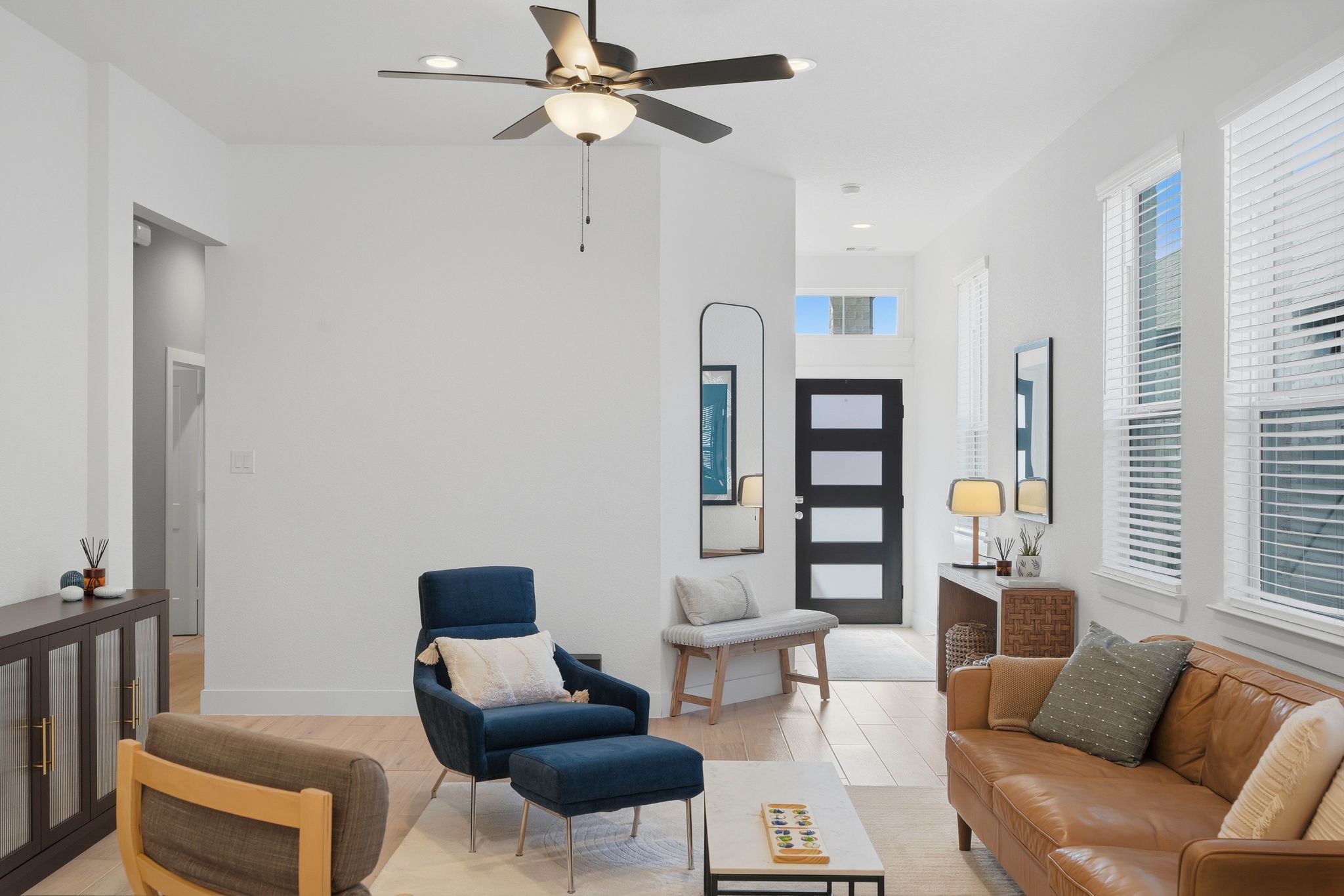 17907 Purple Amaranth Conroe, TX 77385 - Photo 7 of 30 a living room with furniture a ceiling fan and a window