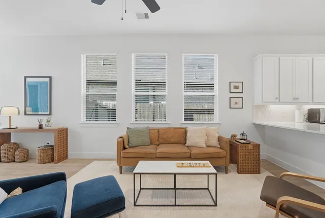 a living room with furniture and a window
