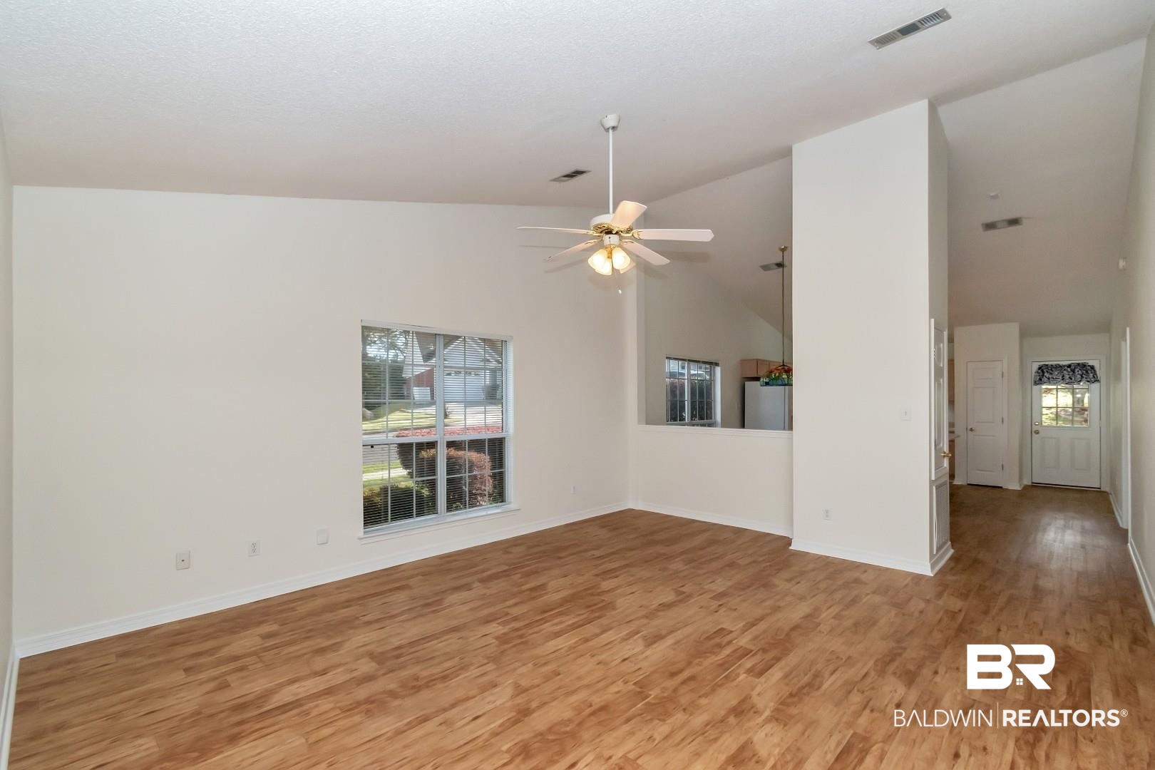 672 Spring Lake Drive East Mobile, AL 36695 - Photo 24 of 26 Empty room with light wood-style flooring, baseboards, visible vents, and ceiling fan