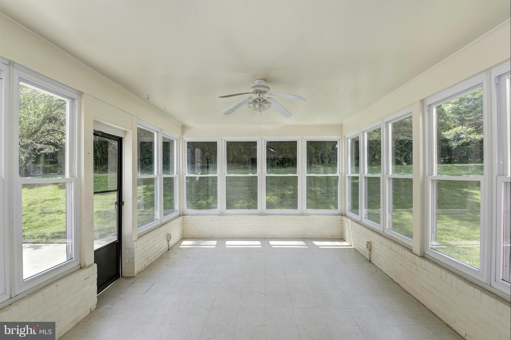 7716 Groton Road Bethesda, MD 20817 - Photo 16 of 30 SUN ROOM OVER LOOKING LANDSCAPED YARD