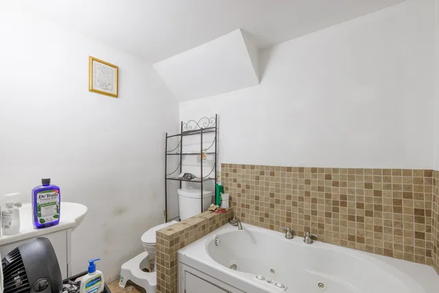 a kitchen with cabinets and window