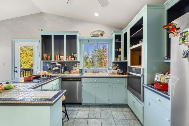 a room with lots of furniture and air hockey table