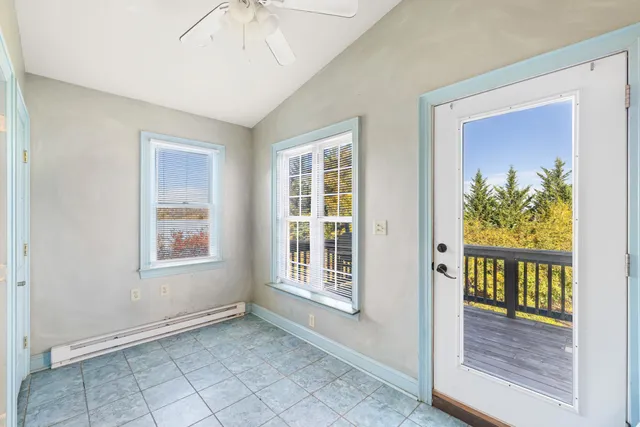 a view of a two chairs on the roof deck