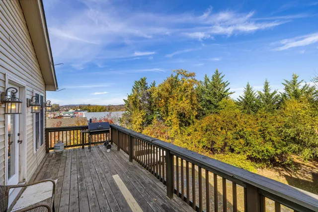 a view of an empty room and wooden floor