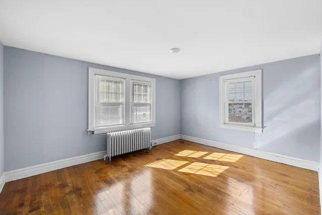 a view of an empty room with white walls