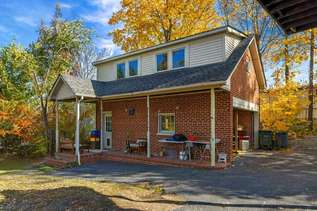 a view of a house with a street