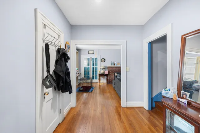 a living room with furniture a fireplace and a window