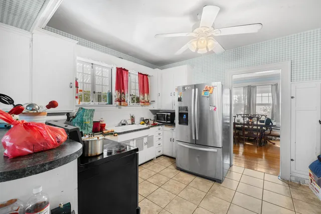 a kitchen with a sink cabinets and window