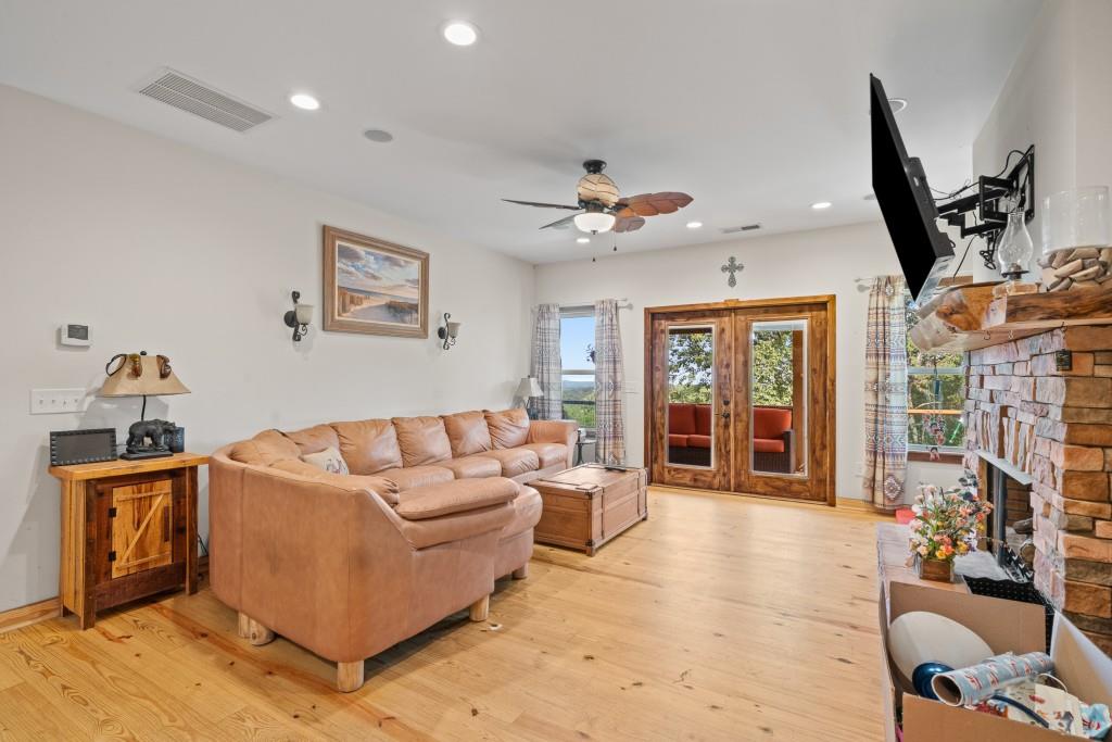 1688 Mulberry Circle Jasper, GA 30143 - Photo 19 of 90 a living room with furniture a window and a flat screen tv