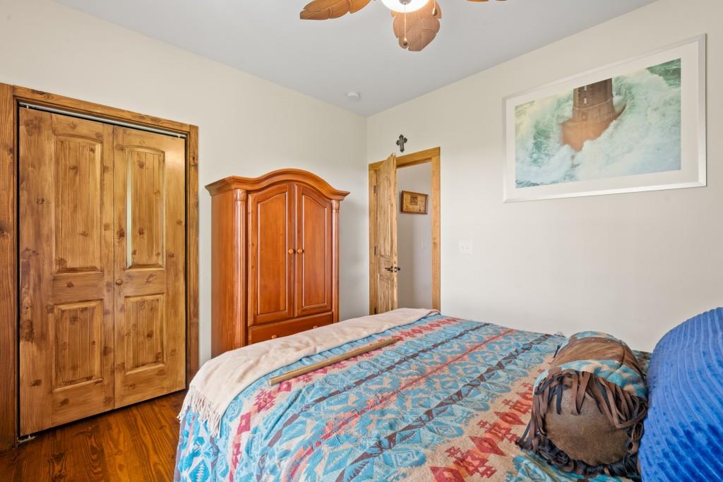 1688 Mulberry Circle Jasper, GA 30143 - Photo 35 of 90 a bedroom with bed and wooden floor