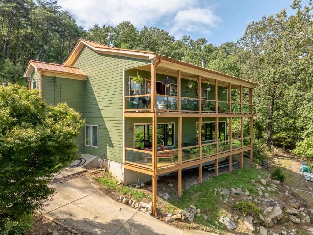 1688 Mulberry Circle Jasper, GA 30143 - Photo 4 of 90 a view of a house with a window and balcony
