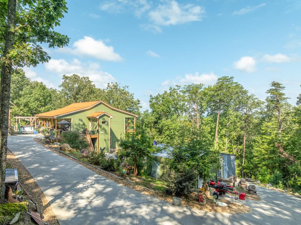 1688 Mulberry Circle Jasper, GA 30143 - Photo 48 of 90 a view of a house with a street and a yard
