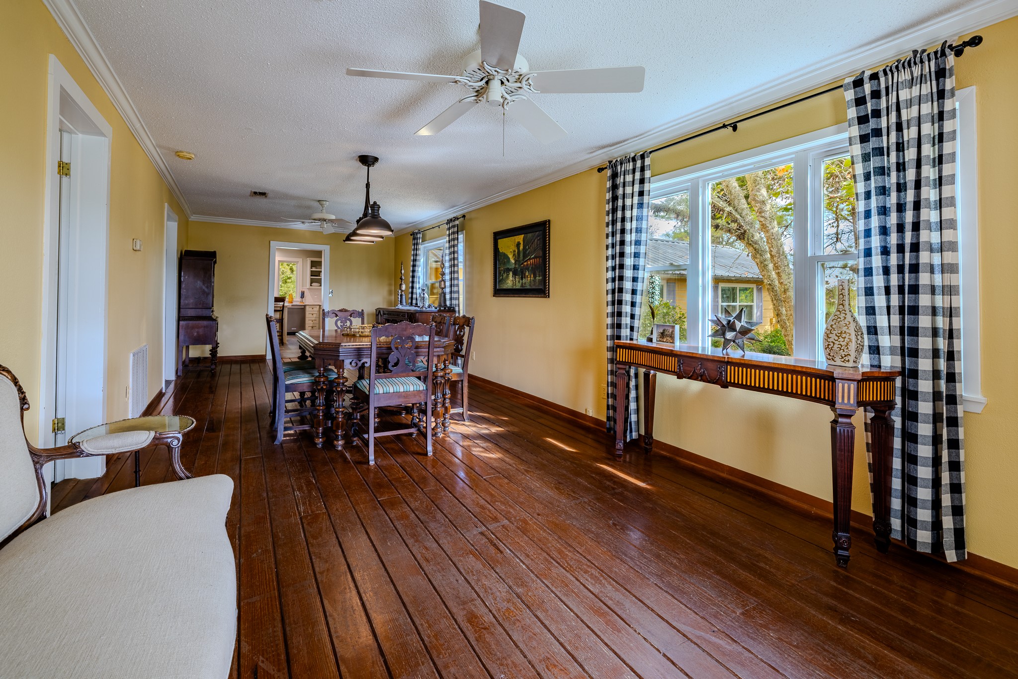 3100 Trails End Lane Brenham, TX 77833 - Photo 11 of 50 a dining room with wooden floor a chandelier a wooden table and chairs