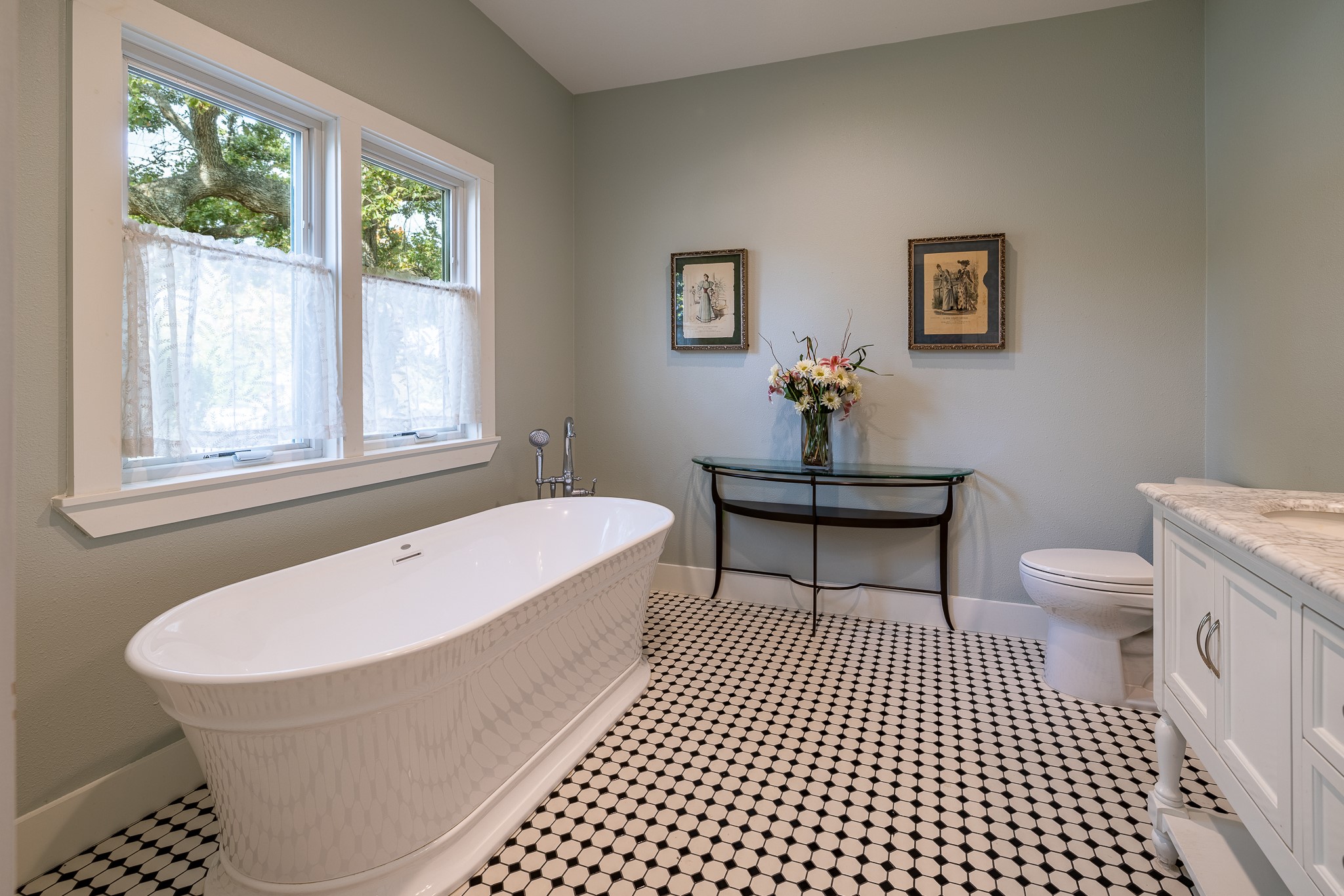 3100 Trails End Lane Brenham, TX 77833 - Photo 14 of 50 a bathroom with a bathtub a toilet a baby crib and a window