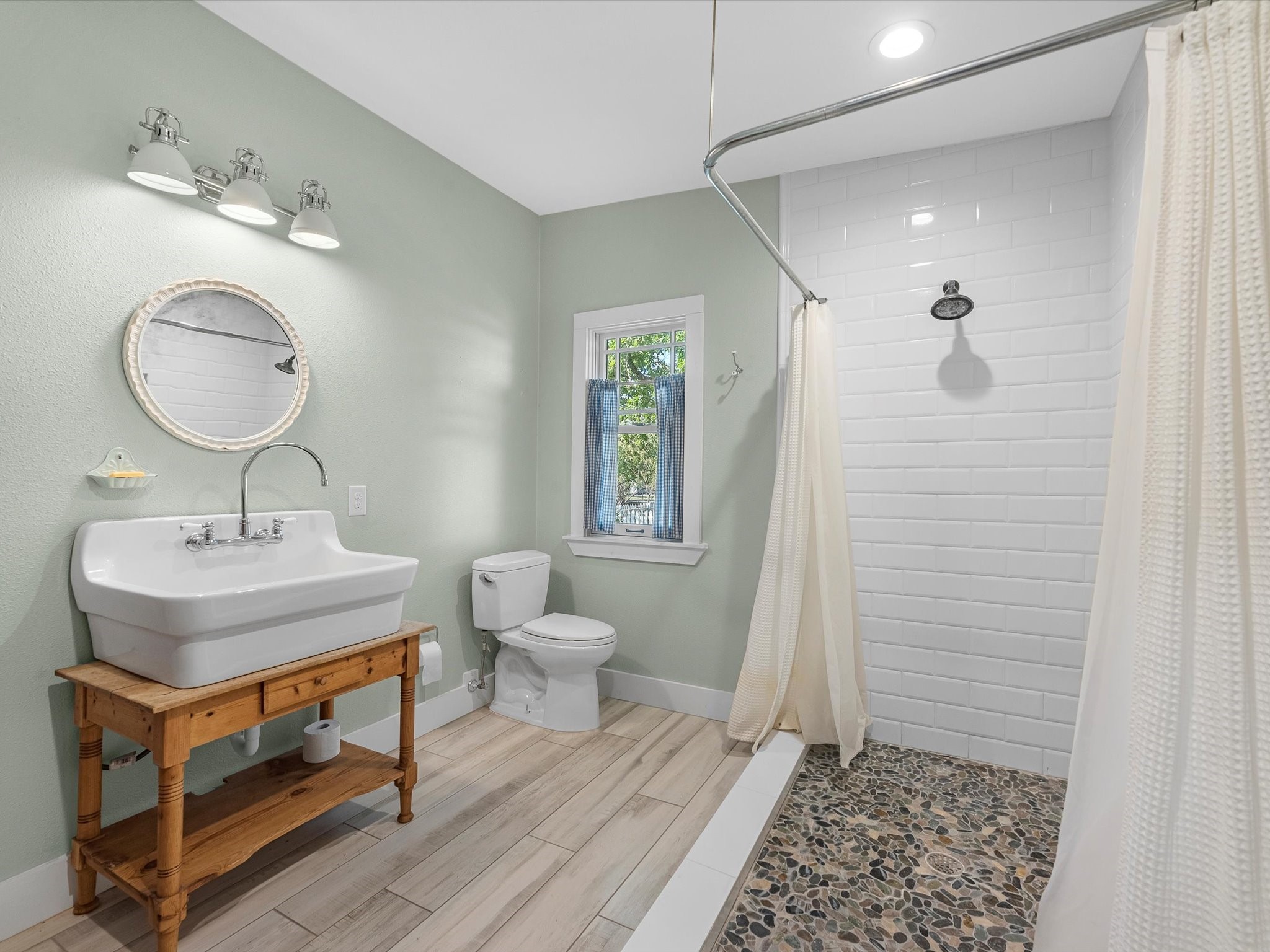 3100 Trails End Lane Brenham, TX 77833 - Photo 18 of 50 a bathroom with a sink toilet a mirror and shower