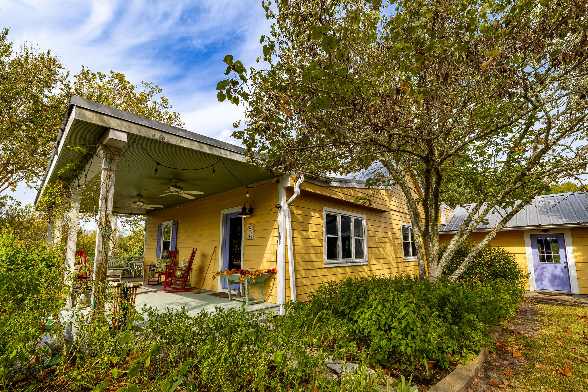 3100 Trails End Lane Brenham, TX 77833 - Photo 25 of 50 a view of a white house with large windows and a small yard