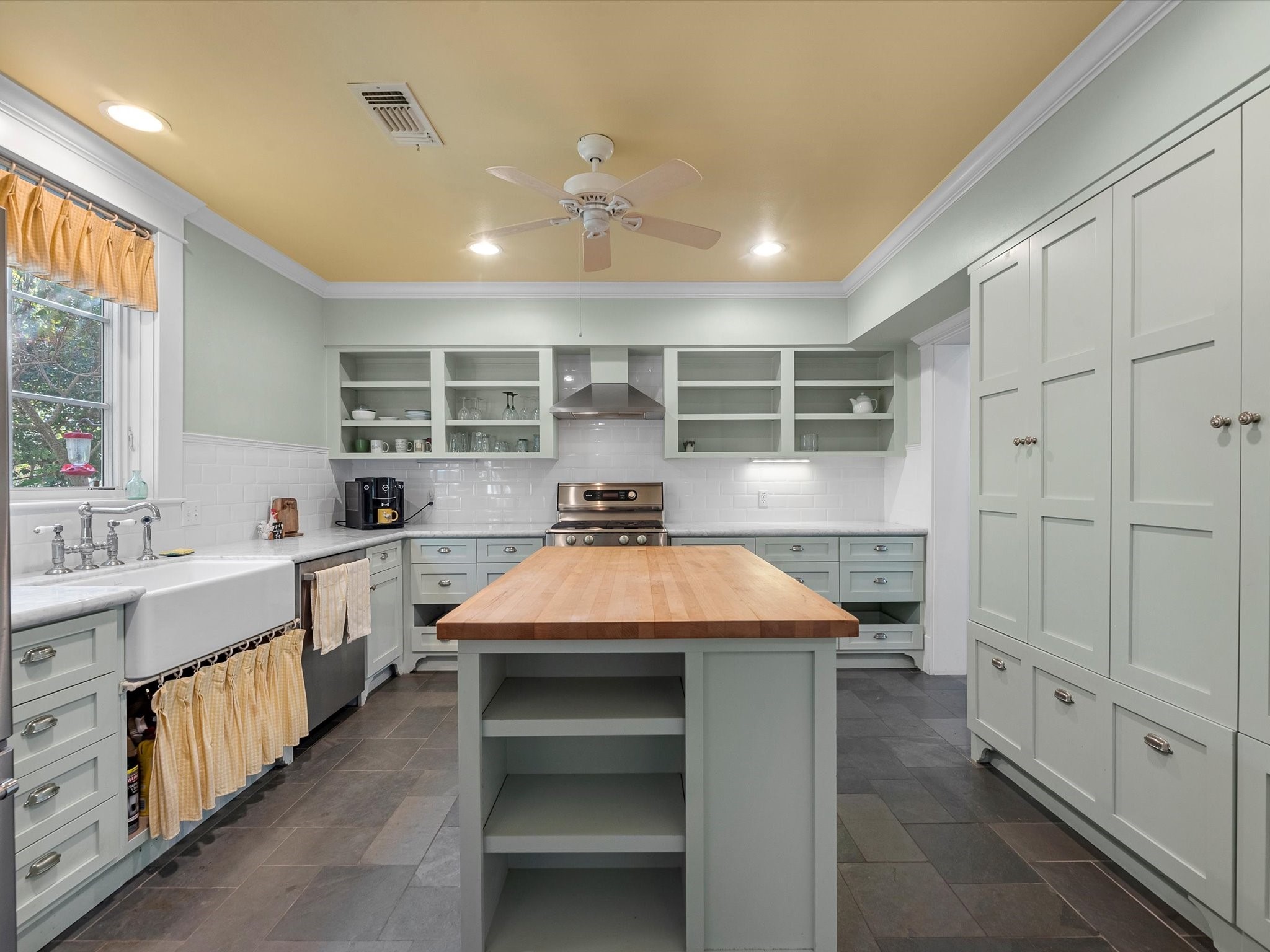 3100 Trails End Lane Brenham, TX 77833 - Photo 31 of 50 a large white kitchen with kitchen island a sink stainless steel appliances and cabinets