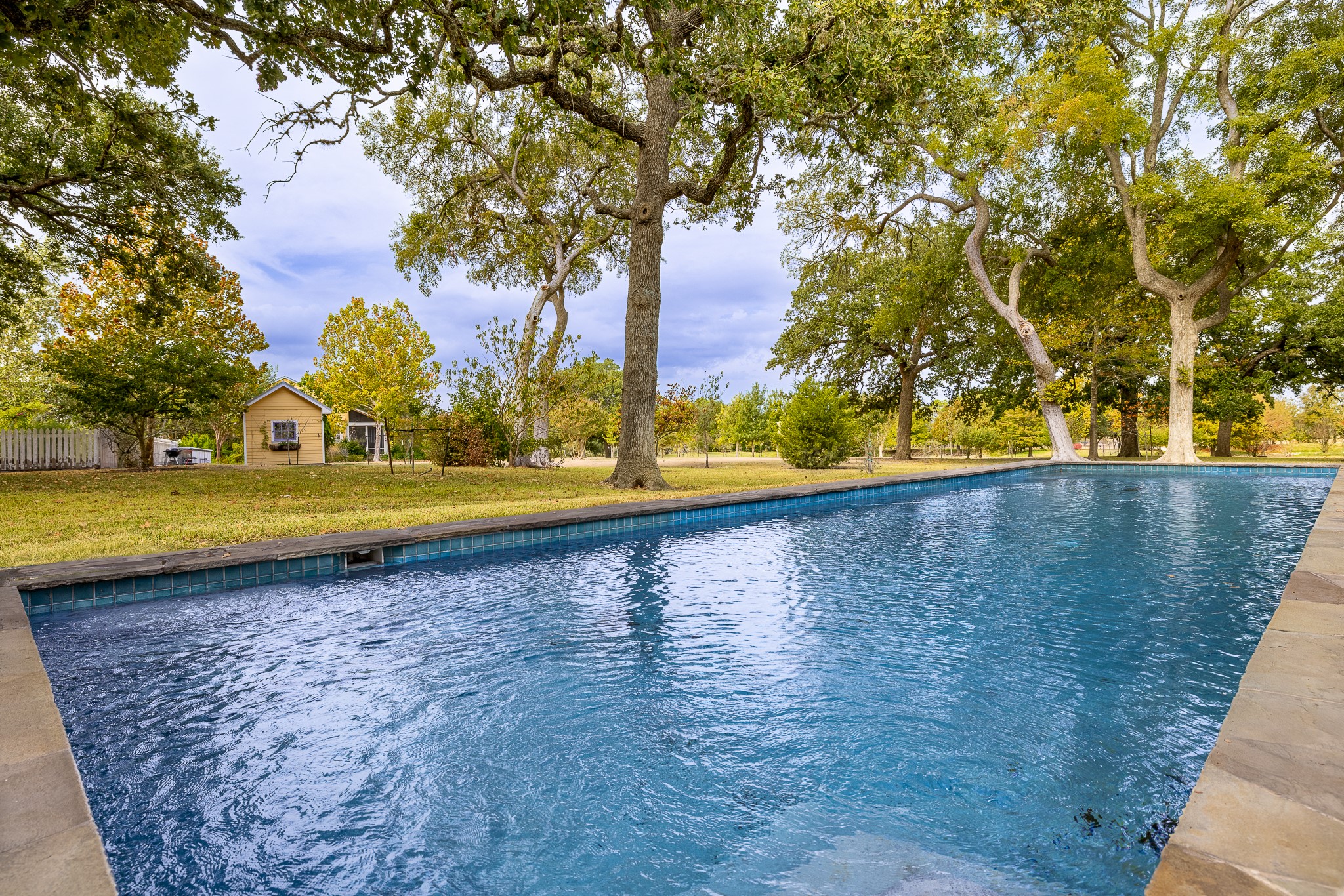 3100 Trails End Lane Brenham, TX 77833 - Photo 4 of 50 a view of a swimming pool with an outdoor space