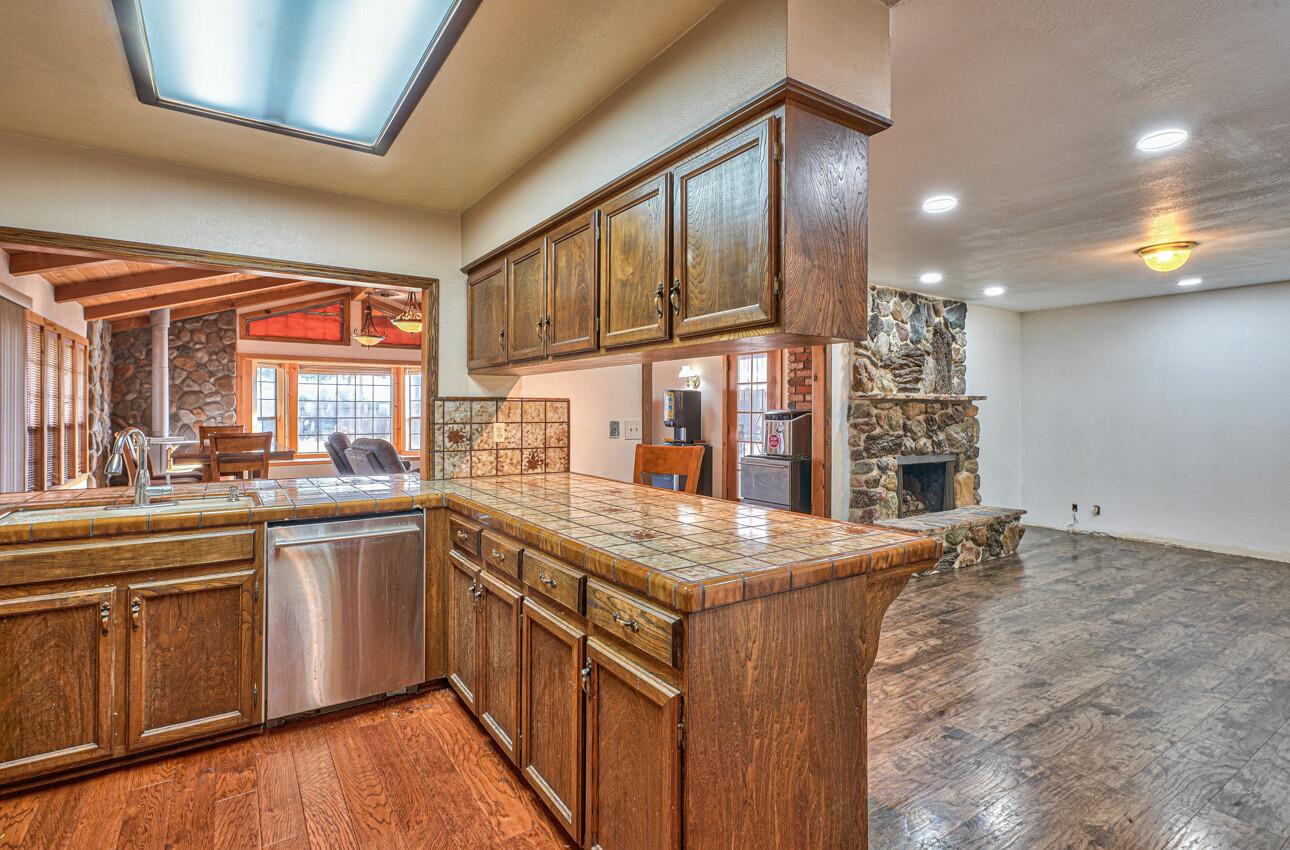 19682 Rogge Road Salinas, CA 93906 - Photo 11 of 22 a kitchen with stainless steel appliances granite countertop a stove a sink and a refrigerator