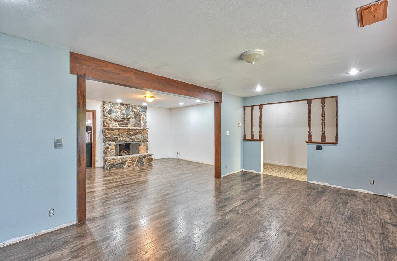 19682 Rogge Road Salinas, CA 93906 - Photo 6 of 22 a view of an empty room with wooden floor and a window
