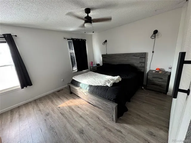 a bed sitting in a room next to a window