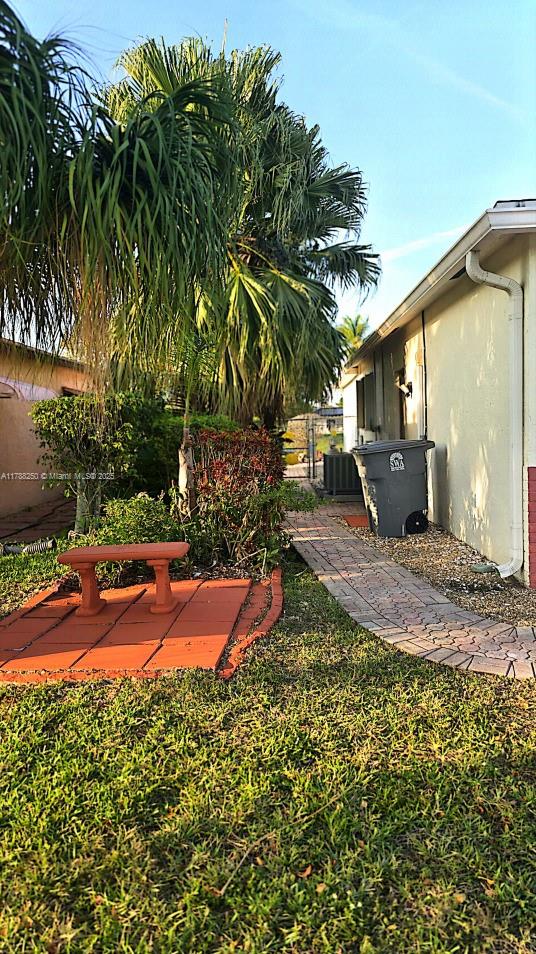 10935 Gable Street Boca Raton, FL 33428 - Photo 21 of 31 a backyard of a house with yard and outdoor seating