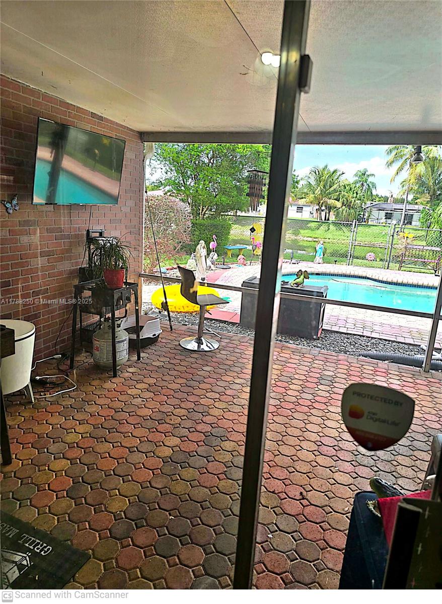 10935 Gable Street Boca Raton, FL 33428 - Photo 6 of 31 a view of a swimming pool with a patio
