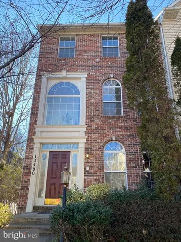 a brick building with a windows on the door