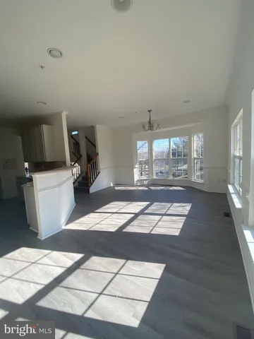 a view of a livingroom with furniture and windows