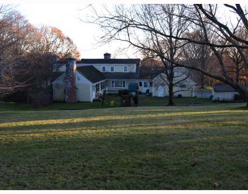 Undisclosed Address Greenwich, CT 06831 - Photo 6 of 10 a view of a house with a yard