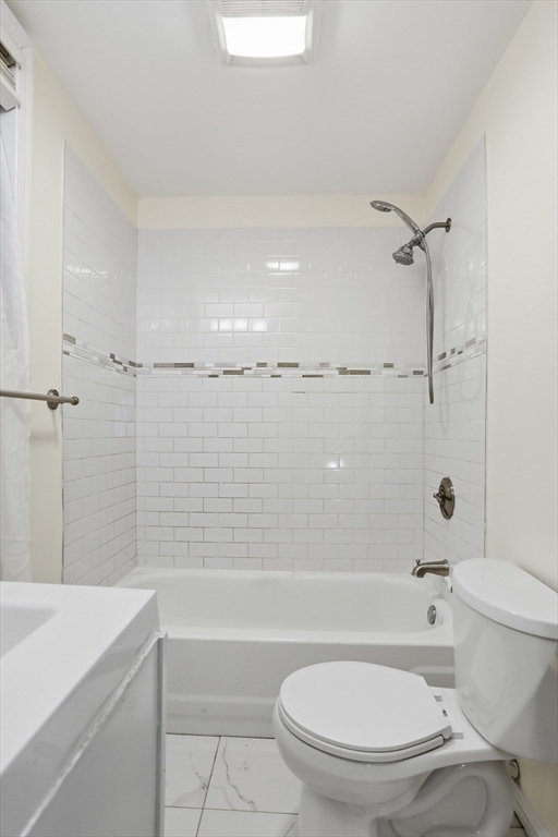 13 Howard Street, Unit 1 Cambridge, MA 02139 - Photo 11 of 21 a bathroom with a toilet sink and shower