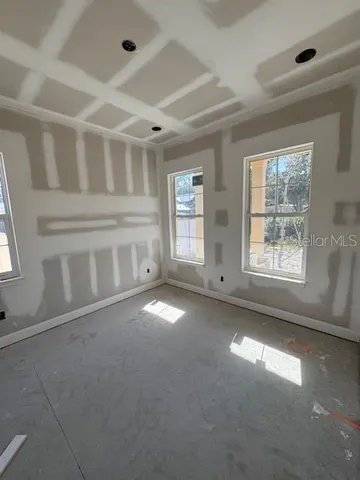 a view of empty room with windows