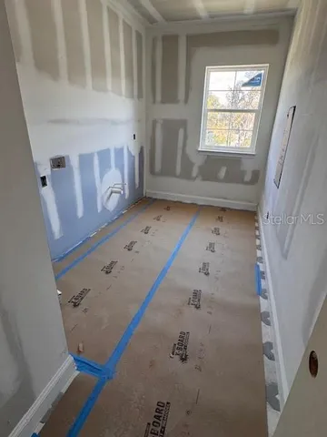 view of an empty room with a window