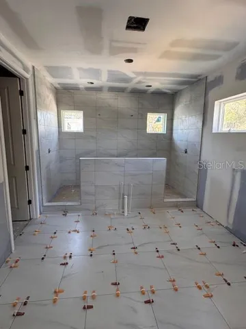a bathroom with a sink and shower