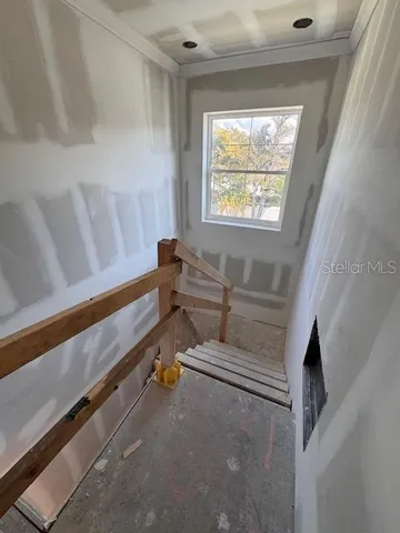 a bathroom with a window and a shower