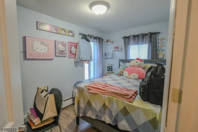 a bedroom with a bed and a chair