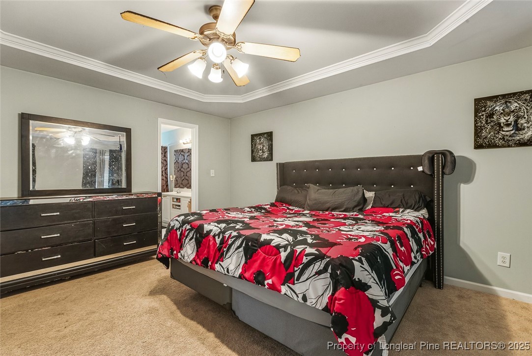 10 Pender Road Spring Lake, NC 28390 - Photo 16 of 23 a bedroom with a bed and window with lamp
