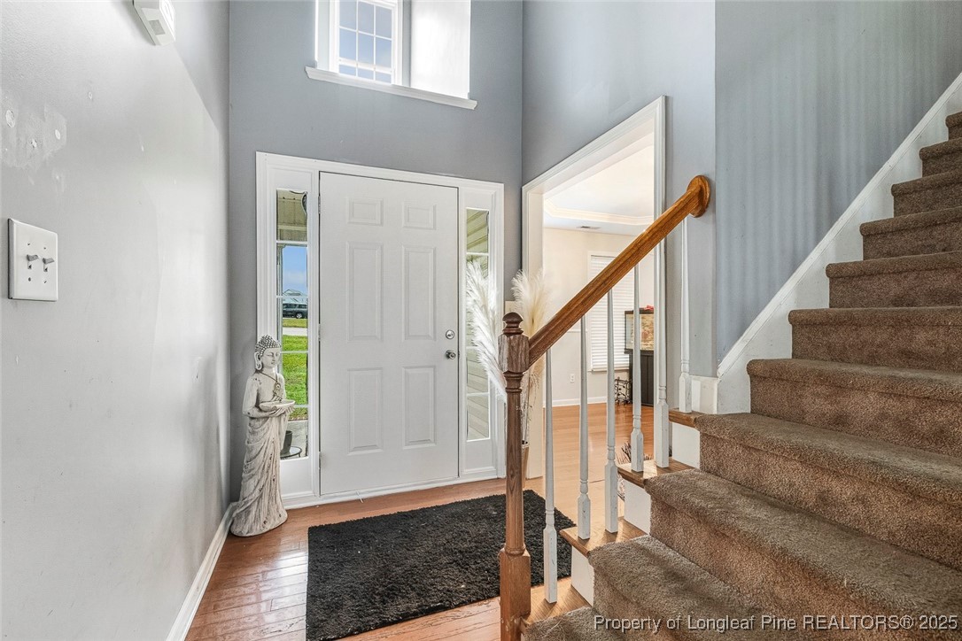 10 Pender Road Spring Lake, NC 28390 - Photo 4 of 23 a view of entryway with wooden floor and stairs