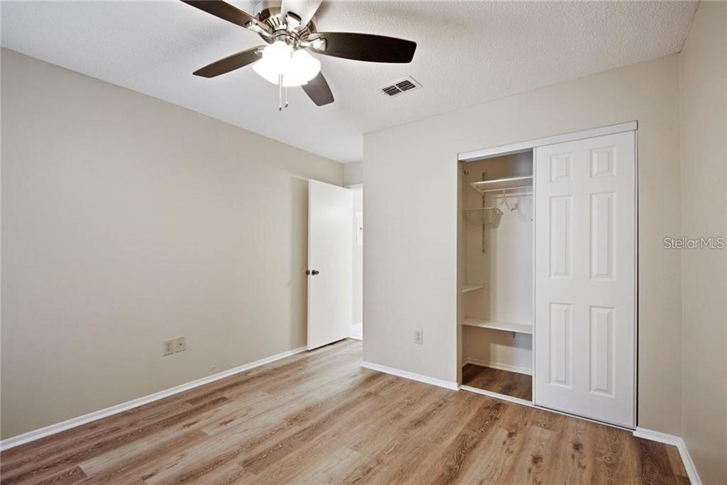4006 Angel Oak Court, Unit 202 Tampa, FL 33613 - Photo 12 of 15 wooden floor in an empty room