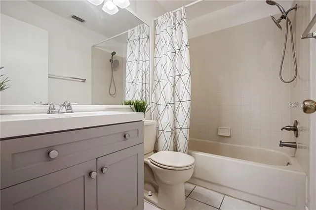 a bathroom with a sink a toilet and a bathtub