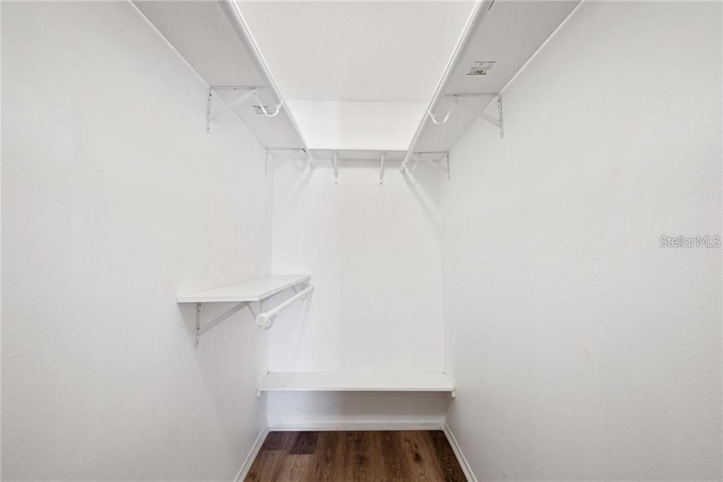 4006 Angel Oak Court, Unit 202 Tampa, FL 33613 - Photo 14 of 15 a view of walk in closet with empty racks