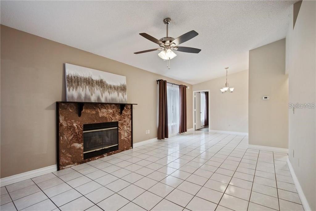 4006 Angel Oak Court, Unit 202 Tampa, FL 33613 - Photo 3 of 15 a view of an empty room and fire place