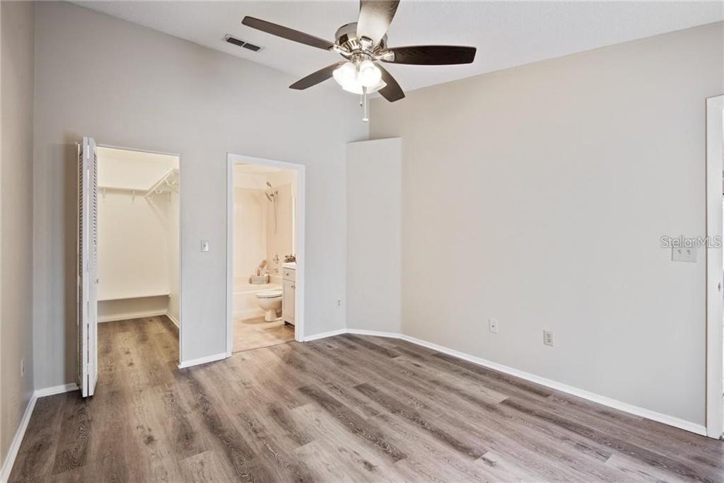 4006 Angel Oak Court, Unit 202 Tampa, FL 33613 - Photo 8 of 15 a view of empty room with wooden floor