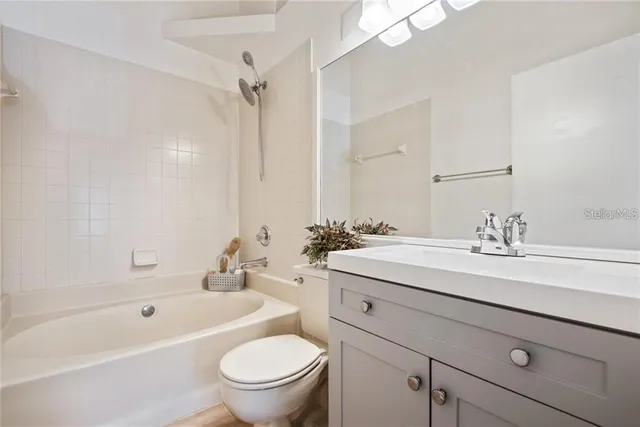 a bathroom with a sink a toilet and a bathtub