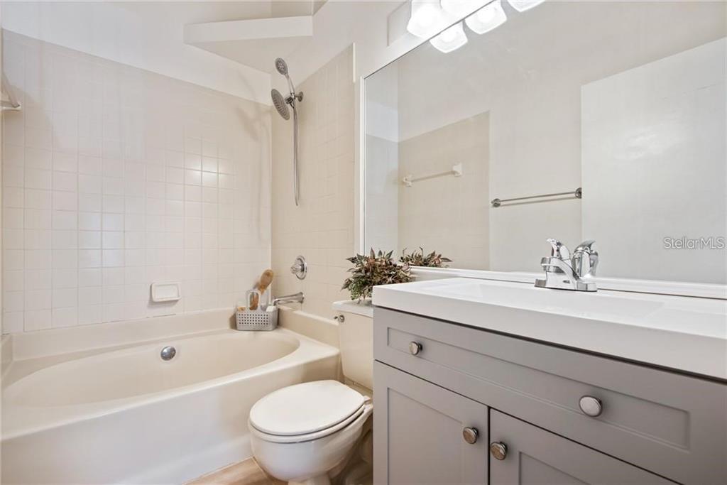 4006 Angel Oak Court, Unit 202 Tampa, FL 33613 - Photo 10 of 15 a bathroom with a sink a toilet and a bathtub