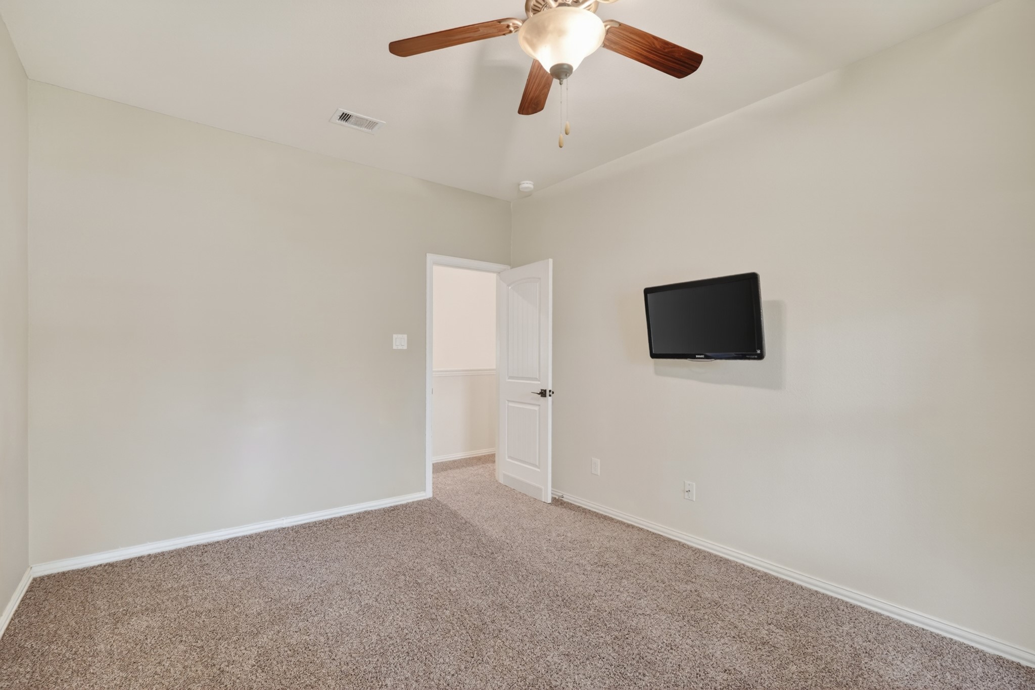 79 West Jagged Ridge Circle Spring, TX 77389 - Photo 38 of 50 Another generously sized secondary bedroom rounds out the upper level, offering plenty of room for a bed and additional furniture along with easy closet access. This flexible space is ready to serve as a bedroom, playroom, or dedicated workspace.